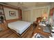Bedroom featuring a built-in Murphy bed, closet, and wood-look flooring at 1308 63Rd Nw St, Bradenton, FL 34209