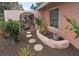 Front garden area with stepping stones leading to a private patio with rock garden, mature shrubs and walkway at 1308 63Rd Nw St, Bradenton, FL 34209