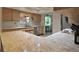 Bright kitchen features light wood cabinets, a stainless steel dishwasher, and speckled countertops at 1308 63Rd Nw St, Bradenton, FL 34209