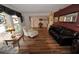Bright living room featuring hardwood floors, large windows, and classic decor at 1308 63Rd Nw St, Bradenton, FL 34209