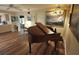 Spacious living area with hardwood floors and a grand piano with a painting of a sailboat hanging behind at 1308 63Rd Nw St, Bradenton, FL 34209