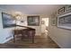 Spacious living area featuring hardwood floors and a grand piano with art hanging on the walls at 1308 63Rd Nw St, Bradenton, FL 34209
