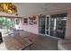 Cozy patio with a table, comfortable seating, and access to the outdoors at 1308 63Rd Nw St, Bradenton, FL 34209