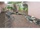 Private outdoor patio with brick flooring, rock features, and comfortable seating area at 1308 63Rd Nw St, Bradenton, FL 34209