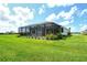 Expansive backyard with a large screened-in patio, offering plenty of space for outdoor activities and enjoying the scenery at 13908 Painted Loop, Parrish, FL 34219