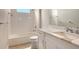 This bathroom is well-lit and features a modern vanity, sink and faucet, and a shower-tub combo at 13908 Painted Loop, Parrish, FL 34219