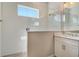 Modern bathroom featuring a tiled walk-in shower and a vanity with quartz countertop at 13908 Painted Loop, Parrish, FL 34219