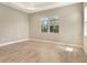 Empty bedroom with tile flooring, recessed lighting, and a large window at 13908 Painted Loop, Parrish, FL 34219