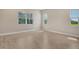 Large empty bedroom with tile floors and three windows offering lots of natural light at 13908 Painted Loop, Parrish, FL 34219