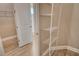 Walk-in closet with shelving and tile floors at 13908 Painted Loop, Parrish, FL 34219