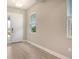 Bright entryway featuring neutral paint, tile flooring, and a view to the exterior at 13908 Painted Loop, Parrish, FL 34219