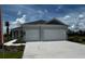 Single Gathering home boasting a two-car garage, neutral color palette, and a well-kept lawn and landscaping at 13908 Painted Loop, Parrish, FL 34219