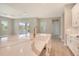 Bright kitchen with white cabinets, quartz countertops, and gold faucet at 13908 Painted Loop, Parrish, FL 34219