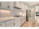 Well-equipped kitchen with gas range, stainless appliances, and ample counter space at 13908 Painted Loop, Parrish, FL 34219
