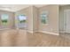 Bright living room with tile floors, recessed lighting, and access to the outdoor patio at 13908 Painted Loop, Parrish, FL 34219