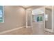 Office space featuring glass french doors, tile floors, and natural light at 13908 Painted Loop, Parrish, FL 34219