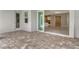 Covered patio with stone pavers and views of the interior of the house at 13908 Painted Loop, Parrish, FL 34219
