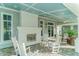 Relaxing outdoor patio with a fireplace and comfortable seating area at 13908 Painted Loop, Parrish, FL 34219