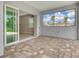 Spacious patio with brick floors and large window overlooking backyard at 13908 Painted Loop, Parrish, FL 34219