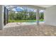 Relaxing screened patio overlooking a sparkling pool and lush backyard, perfect for outdoor enjoyment at 13908 Painted Loop, Parrish, FL 34219