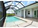 This private, screened-in pool provides year-round enjoyment with relaxing views of the lush garden at 13908 Painted Loop, Parrish, FL 34219