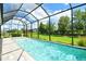 Enjoy outdoor living with this screened-in pool and beautiful backyard views at 13908 Painted Loop, Parrish, FL 34219