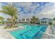 Resort-style pool surrounded by lush landscaping and comfortable lounge chairs at 13908 Painted Loop, Parrish, FL 34219