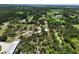 Extensive land with a house and pond, complemented by lush trees and open spaces, perfect for recreation at 15780 Wilson Rd, Sarasota, FL 34240