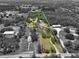 A sprawling estate as seen from above highlighting the vast green spaces and diverse property layout at 15780 Wilson Rd, Sarasota, FL 34240