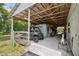 Covered barn featuring vehicle storage and concrete flooring, perfect for protecting equipment and supplies at 15780 Wilson Rd, Sarasota, FL 34240