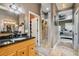 Bathroom showcasing granite countertops, dual sinks, and a walk-in shower at 15780 Wilson Rd, Sarasota, FL 34240