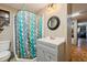 Bathroom featuring a shower with modern vanity and fixtures, designed for convenience at 15780 Wilson Rd, Sarasota, FL 34240