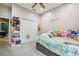 This bedroom features a closet and a bed adorned with an array of stuffed animals at 15780 Wilson Rd, Sarasota, FL 34240