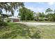 Exterior view of a single-story home with garage and a fenced-in yard at 15780 Wilson Rd, Sarasota, FL 34240