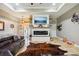 A spacious Gathering room with a fireplace, a large TV, and ample shelving for decorations at 15780 Wilson Rd, Sarasota, FL 34240