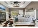 Large main bedroom featuring tray ceiling, sliding glass doors to the patio, and an en-suite bathroom at 15780 Wilson Rd, Sarasota, FL 34240