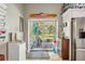 Mud room with a view of the backyard and access to the kitchen at 15780 Wilson Rd, Sarasota, FL 34240