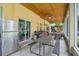 View of the patio featuring outdoor seating, a fridge, and grilling facilities at 15780 Wilson Rd, Sarasota, FL 34240
