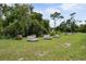 A verdant field contains numerous beehives set upon individual platforms at 15780 Wilson Rd, Sarasota, FL 34240