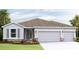 Beautiful single-story home with a neutral color scheme and a spacious three-car garage, situated on a well-maintained lot at 16022 10Th E Ave, Bradenton, FL 34212