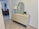 Stylish interior decor featuring a decorative console table, a modern lamp, and an arched mirror at 16087 Sunny Day Dr, Bradenton, FL 34211