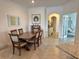 Elegant dining room adjacent to an open concept living space, providing a seamless flow for entertaining at 16087 Sunny Day Dr, Bradenton, FL 34211