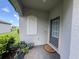 Welcoming entryway with a decorative sidelight, a modern door with a window, and a cozy doormat at 16087 Sunny Day Dr, Bradenton, FL 34211