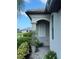 A charming exterior corner showcases a home's architectural details, well-maintained landscaping, and an inviting entryway at 16087 Sunny Day Dr, Bradenton, FL 34211