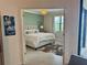 Inviting bedroom boasts serene green walls, natural light, and stylish decor for a tranquil retreat at 16087 Sunny Day Dr, Bradenton, FL 34211