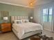 Comfortable bedroom featuring a cozy bed, stylish decor, and natural light for a restful ambiance at 16087 Sunny Day Dr, Bradenton, FL 34211