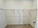Efficient walk-in closet with wire shelving, providing ample storage and organizational space at 16087 Sunny Day Dr, Bradenton, FL 34211