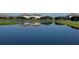 Beautiful water view of luxurious homes, with lush landscaping and serene lake reflection at 16087 Sunny Day Dr, Bradenton, FL 34211