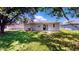 The backyard features a spacious lawn and mature trees, ideal for outdoor activities and relaxation at 1707 24Th E St, Palmetto, FL 34221