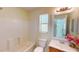 Bright bathroom showcases a tub and shower combo and single sink vanity at 1707 24Th E St, Palmetto, FL 34221